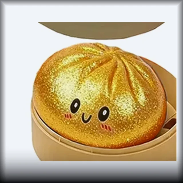 Squishy bao doré pailleté dans son mini panier vapeur en bambou